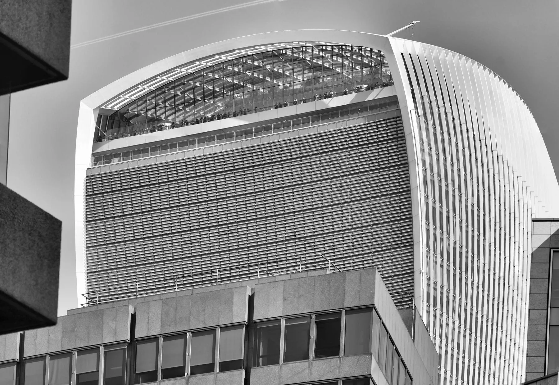 The curved glass tower of 20 Fenchurch Street in the City of London, in black and white